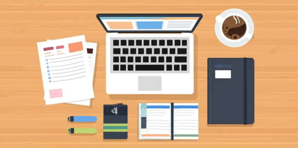 Desk with a laptop, planner, and a cup of coffee