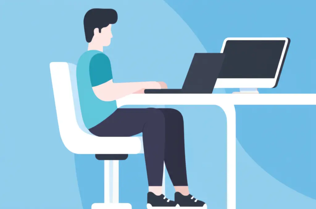 A person sitting comfortably in an ergonomic chair, working on their computer.