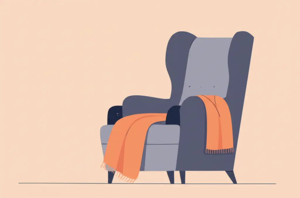 A cozy corner with a soft armchair and a warm throw blanket