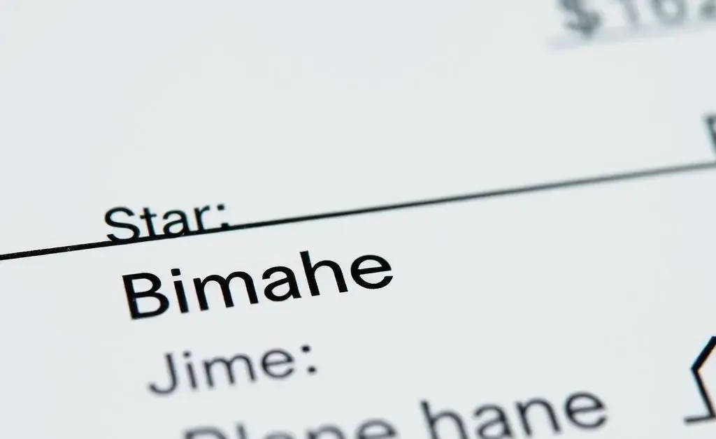A close-up of a check with three different names listed on it