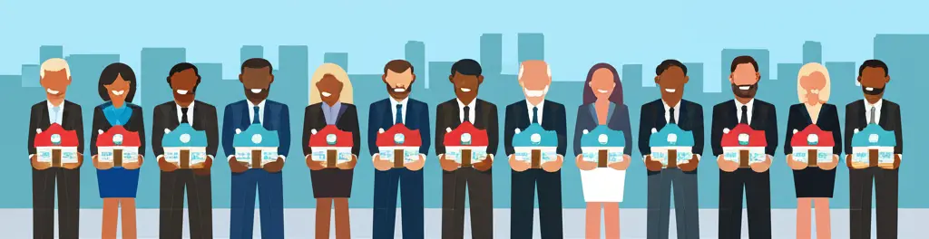 Happy and successful real estate investors holding miniature houses.