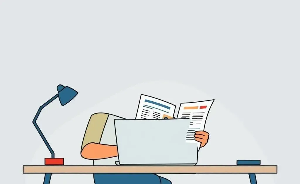 Person planning a budget at a desk with a laptop