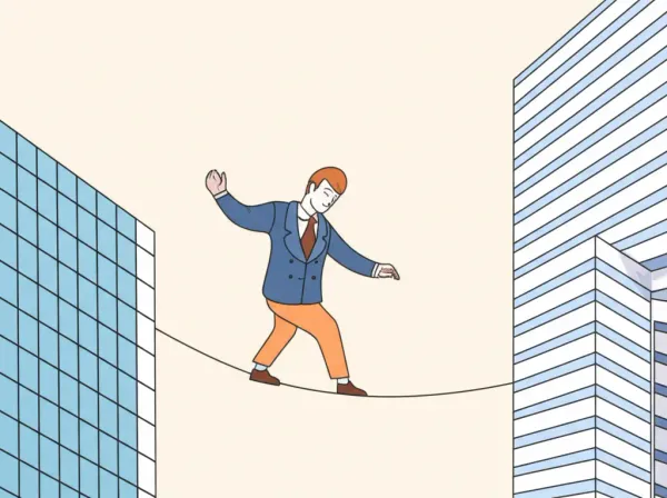 Person balancing on tightrope between skyscrapers, symbolizing work-life balance in investment banking