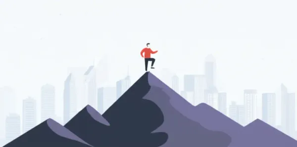 A person climbing a mountain with a city in the background, symbolizing personal growth
