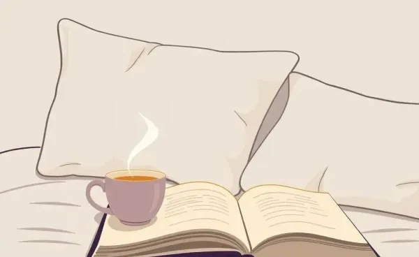 A cozy bedroom scene with a steaming cup of tea on a nightstand next to an open book.