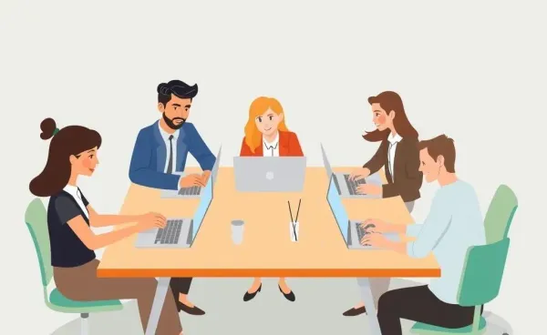 A diverse group of professionals working on laptops around a shared desk.
