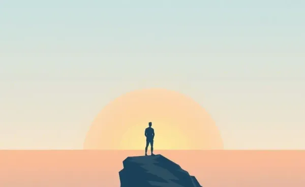 A person standing at the edge of a cliff, gazing at the horizon.