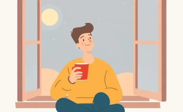 A person enjoying a peaceful moment by the window with a warm drink.