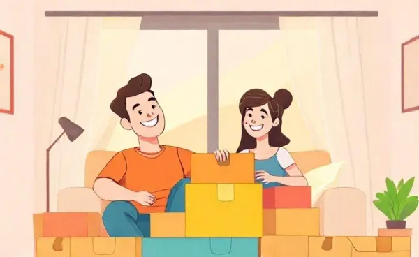 A happy couple in their new home surrounded by moving boxes.