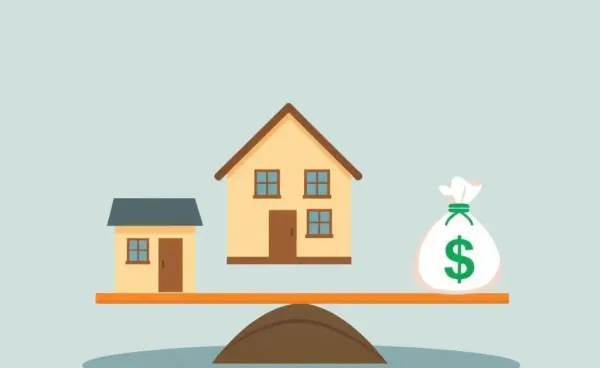 A house on a seesaw with money bags on the other end, illustrating a financial decision.