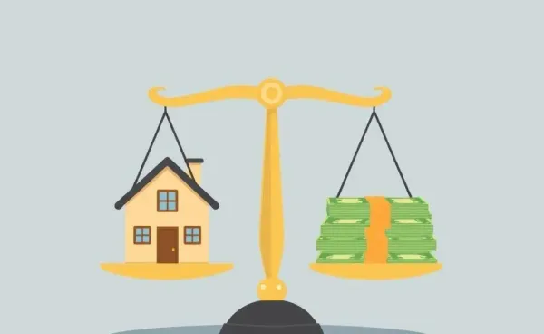A scale balancing a house and a pile of money