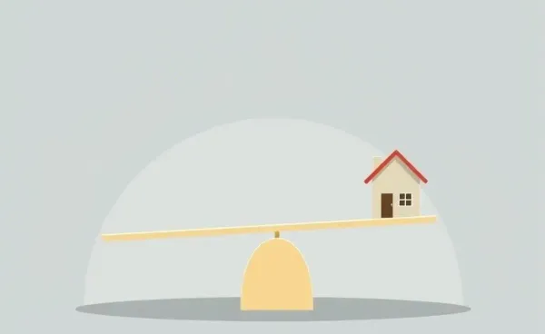 Illustration of a seesaw balancing a house, symbolizing LTV ratio importance
