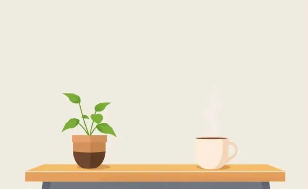 Minimalist workspace with a plant and coffee cup on a desk