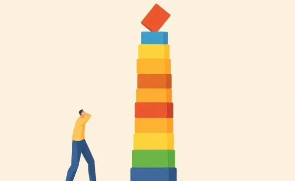 Person stacking blocks to build a tower symbolizing reputation